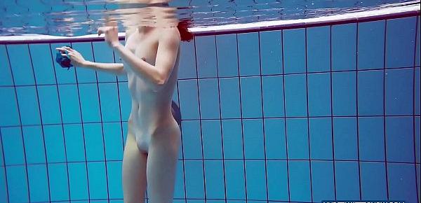  Redhead in blue bikini showing her body